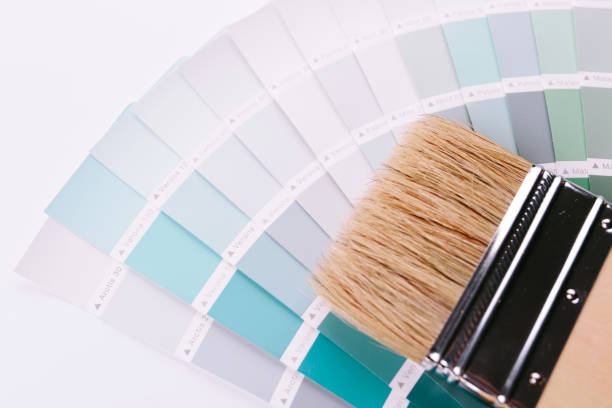 istock Paint brushes placed on top of can filled with blue paint 1194956388
