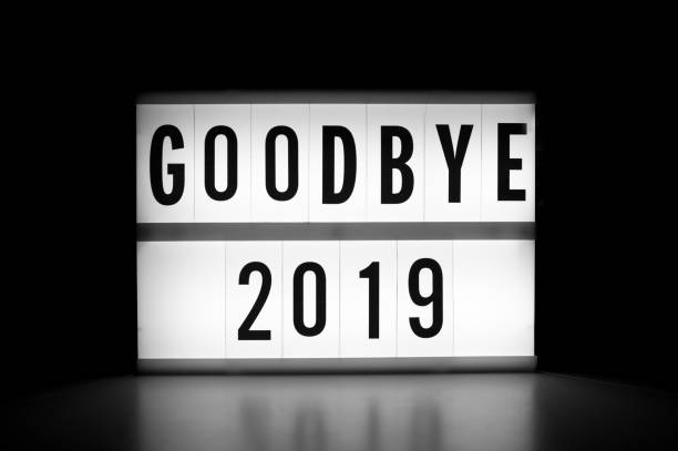 istock Goodbye 2019 - text on a luminous display in the dark. 1194957377