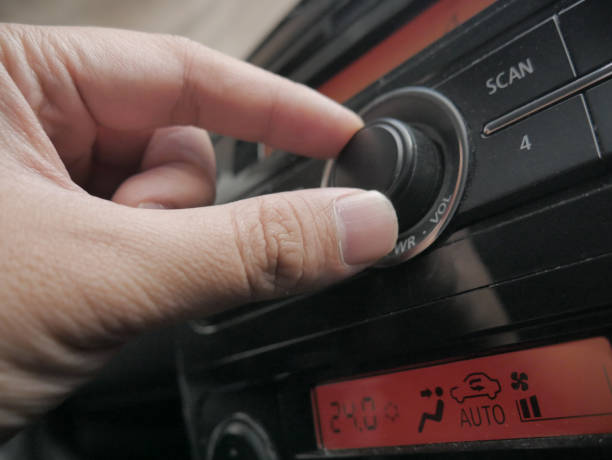 istock Driver's Hand Press Button on Car Radio 1194961424