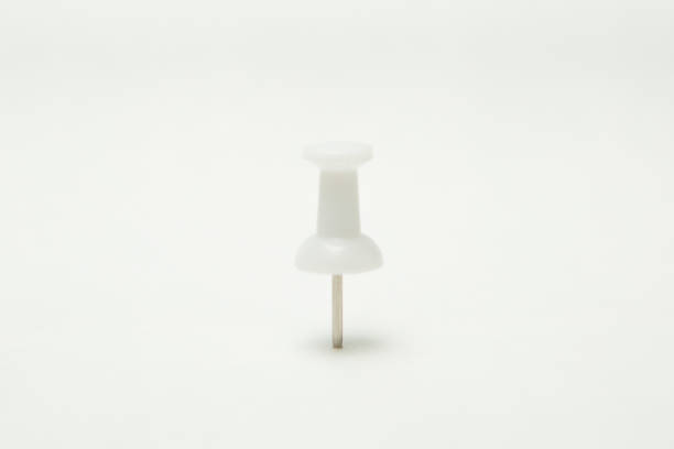 istock Close up of White pin on white background 1194964700