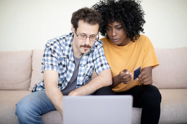 istock Young multi-ethnic couple shopping online 1194965348