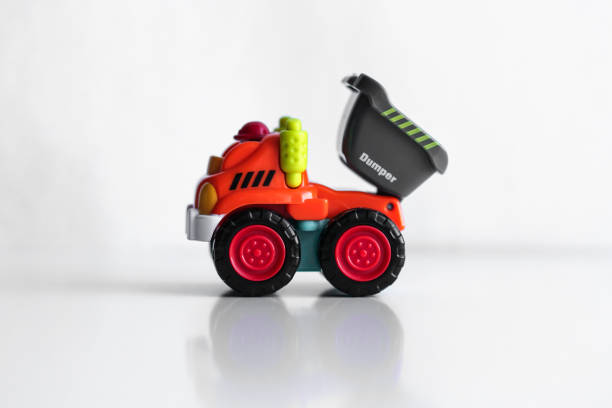 istock Plastic dump truck toy construction vehicle isolated on white background with reflection 1194966349