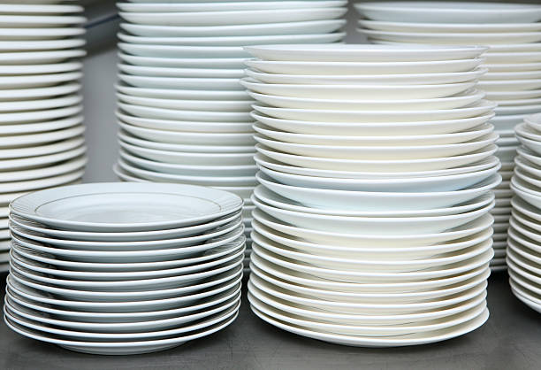 istock pile of dishes plates in kitchen 119496707