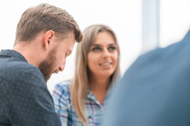 istock close up. two employees sitting at the Desk 1194967253