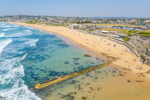 Bar Beach, Newcastle, NSW, Australia.  Newcastle is the second most populated area in the Australian state of New South Wales.  Located at the mouth of the Hunter River, it is famous for its coal and is the largest coal exporting harbour in the world.