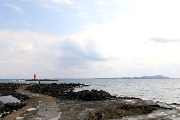 a beautiful view of the beach with a view of lighthouses