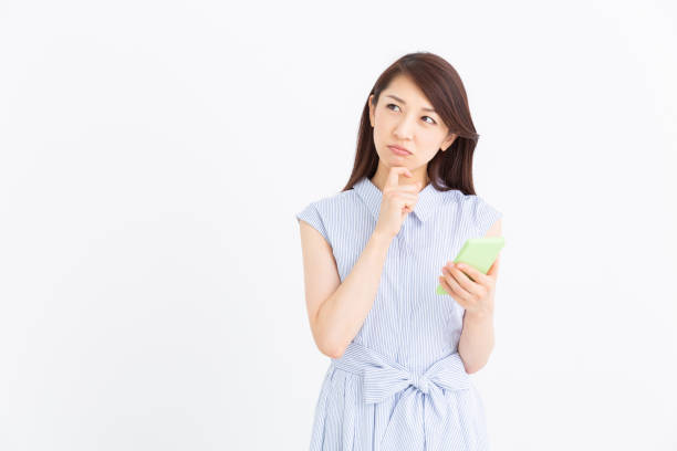 istock asian woman to see a smart phone,think, 1194969614