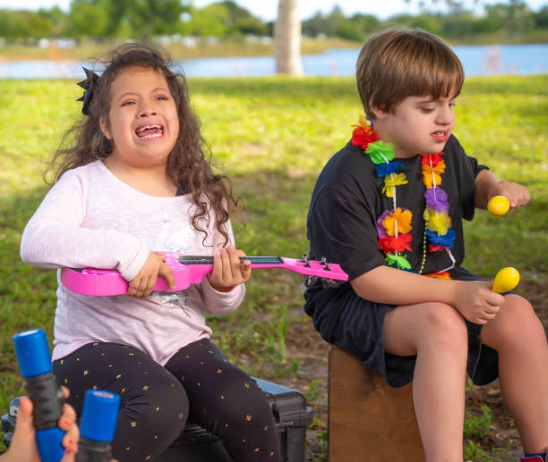 istock Kids playing with music instruments at a park 1194971950
