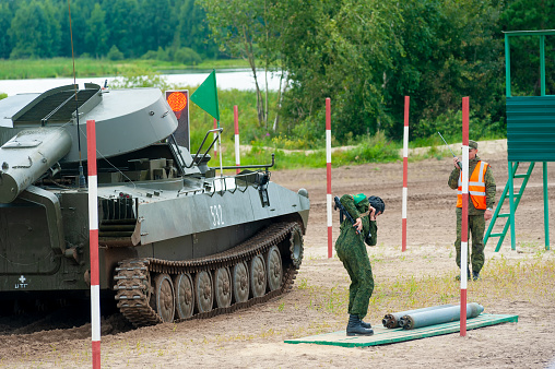 Tyumen, Russia - August 10, 2019: International Army Games. Engineering Formula contest. Highest military and engineering school ground. Belarus crew of Meteorite UR-77 equipment for mine clearing loads shells