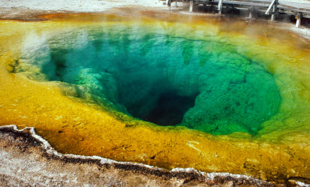 istock Yellowstone National Park -  Morning Glory Pool - Wide View - 1981 1194985177