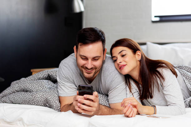 istock Couple lying in bed 1194986999