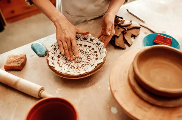 Cropped shot of an unrecognizable artisan working in a pottery workshop