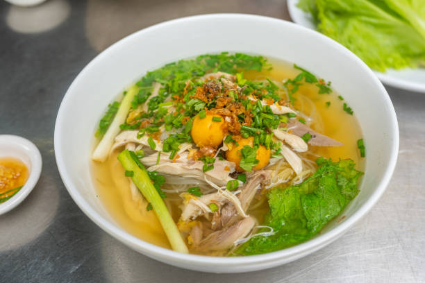 Bowl of delicious chicken pho noodle soup in Vietnamese restaurant stock photo