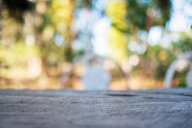 istock a wooden table with blurred nature in background 1194994190