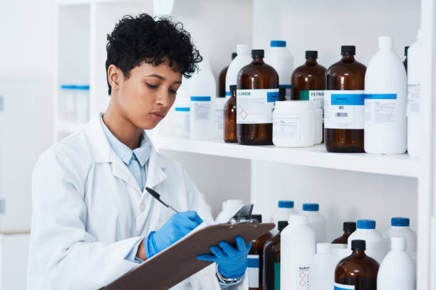 istock Noting down all the stock she has in her lab 1194994555