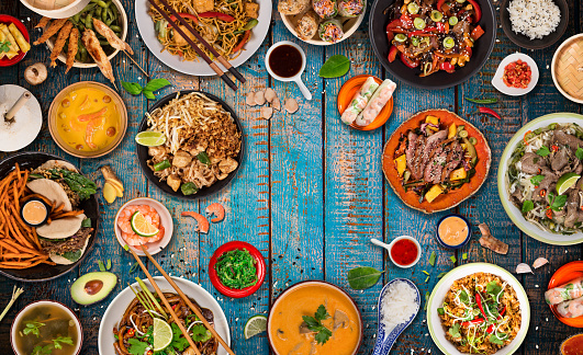 Asian food background with various ingredients on rustic wooden background , top view. Vietnam or Thai cuisine.