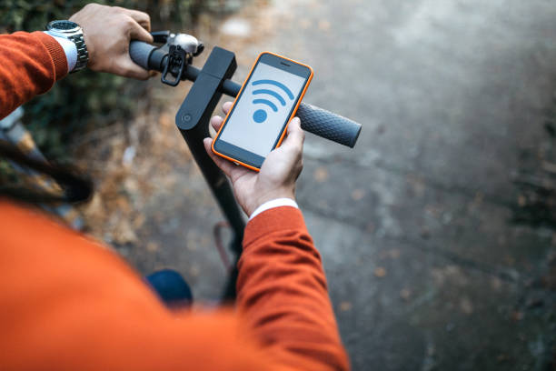 istock Man with electric scooter and mobile phone 1194999159