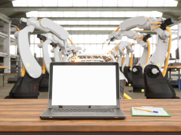 laptop sulla scrivania in una fabbrica - car industry robot arm car plant foto e immagini stock