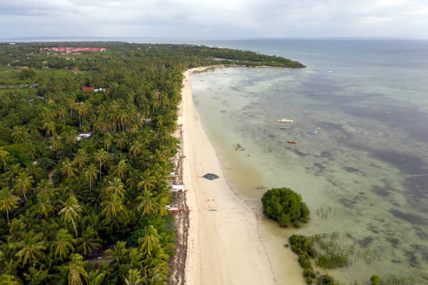 istock Aerial shot Paradise beach (Sandira beach), Bantayan island, North Cebu, Philippines 1195000244