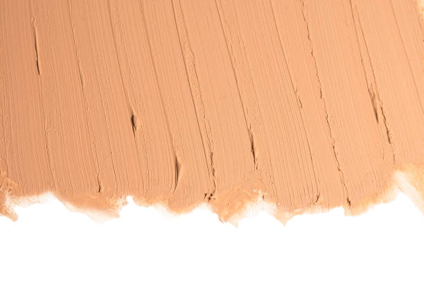 istock Liquid foundation texture. Make up for women. Top view. Isolated on white. Space for text or design. 1195001256