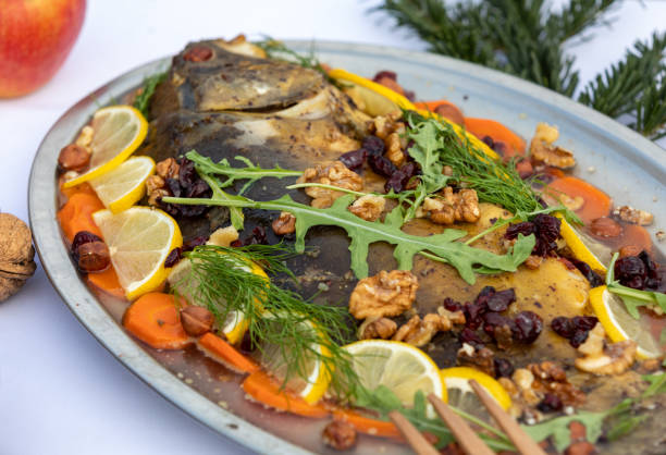 istock carp with lemon, walnuts and raisins on the plate 1195005278