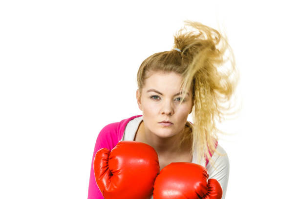 istock Woman wearing boxing gloves 1195005405