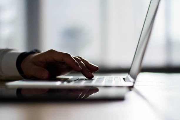 istock Businessman typing on laptop in office, working concept, close up 1195006039