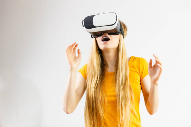 istock Girl wearing virtual reality goggles. 1195006523