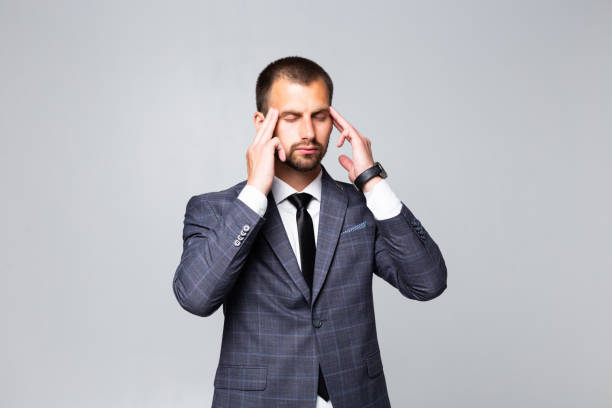 istock Handsome business man thinking over white background 1195007747