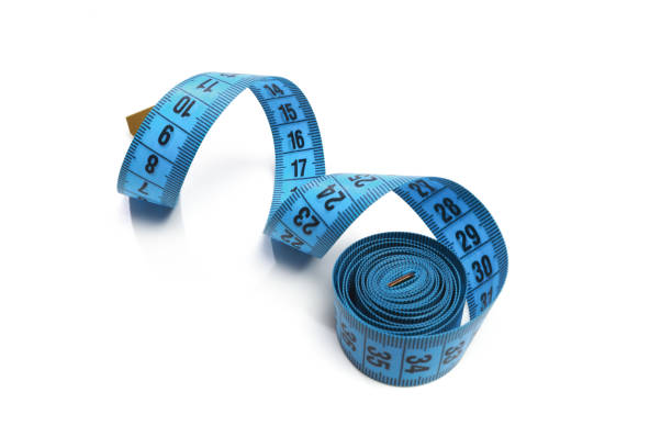 istock Blue measuring tape isolated on white background 1195008833