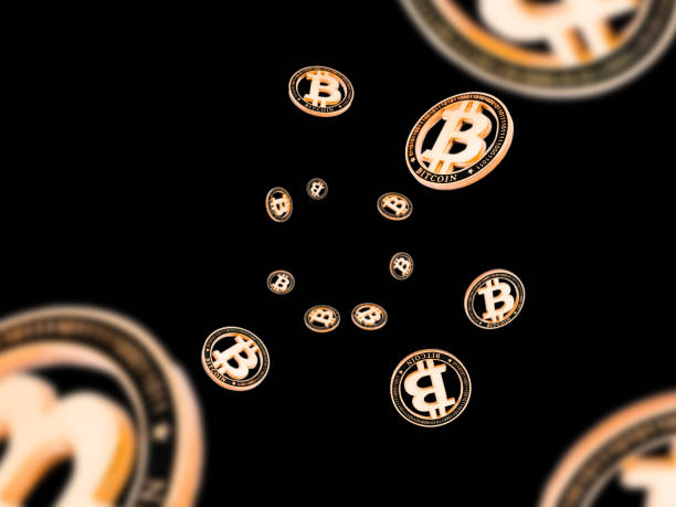 istock Cryptocurrency background. Falling Gold Bitcoin isolated on black. Falling money concept 1195008942