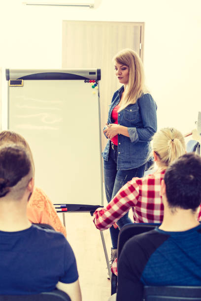 istock Students and teacher in classroom 1195010931
