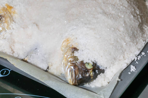 Gilthead breams cooked in salt. Baked fish (doradas).