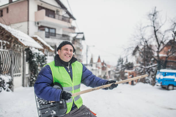 istock Senior man cleans snow 1195014396