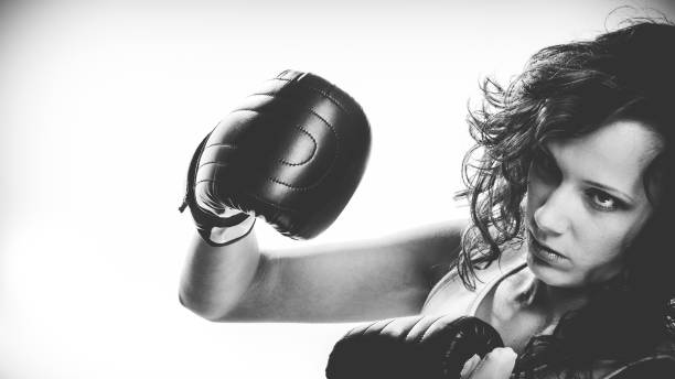 istock Boxer girl exercise with boxing gloves. 1195014470