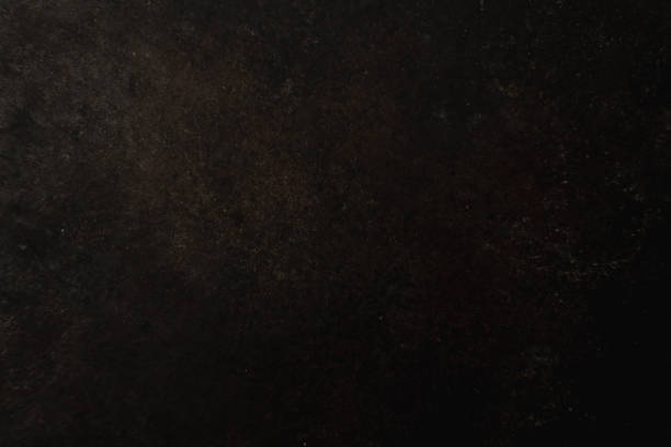 istock uneven rough dark metal surface. close up. background for text and photo processing 1195014683