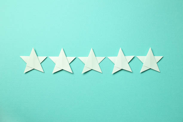 istock Five stars quality rating on mint green background 1195014885