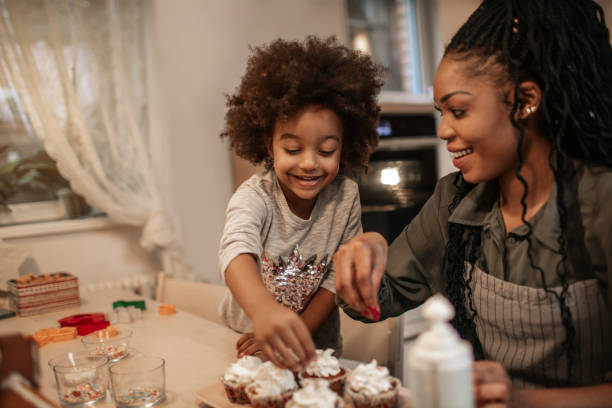 istock Woman Making Creamy Top On Cupcakes 1195017707