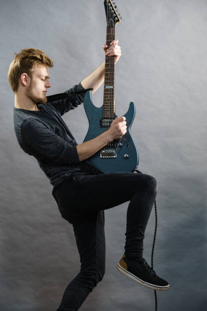 istock Man playing on electric guitar 1195017862