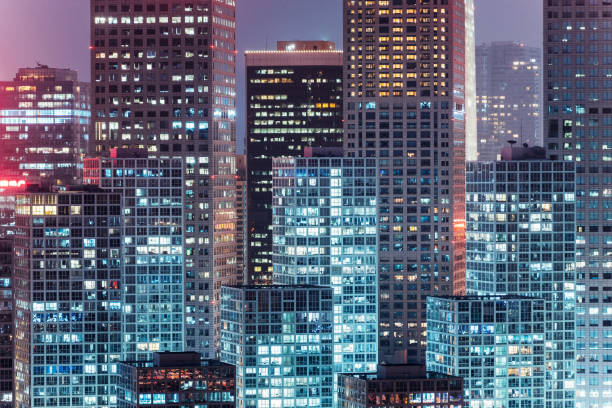 istock facade of modern office buildings at night 1195019889