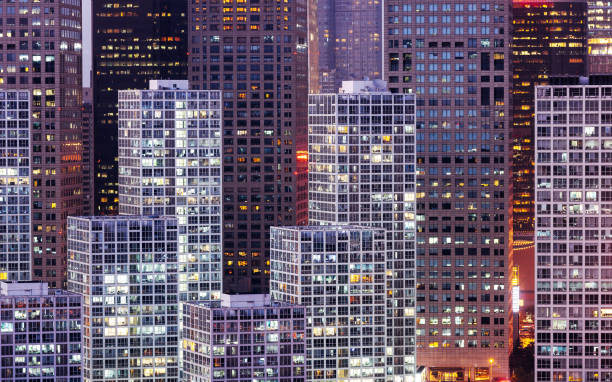 istock facade of modern office buildings at night 1195020047