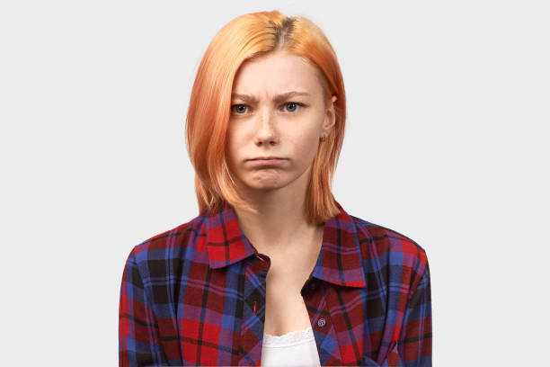 istock irritated woman with anger looks at camera, anger 1195020270