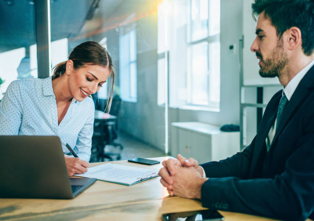 business people signing a contract. - women business men beautiful imagens e fotografias de stock