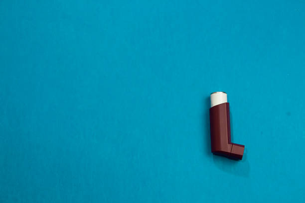 closeup of a spacer, asthma inhaler isolated on white background and copy space