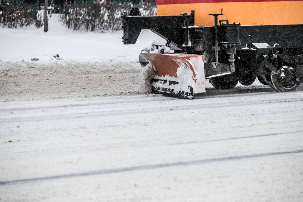 istock Tram snowplow with side wing blade removing snow and ice from Bucharest 1195023272