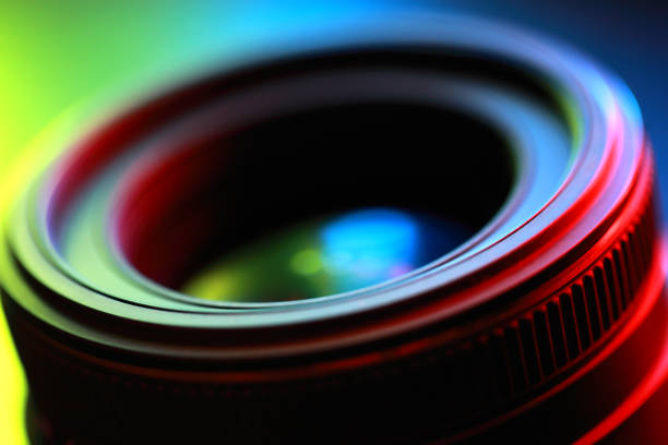 Photographic lens, close-up Photographic lens, close-up n abstract color illuminated. movie camera photos stock pictures, royalty-free photos & images
