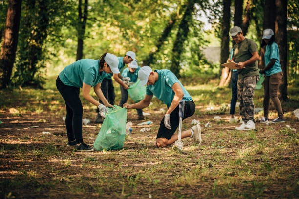 istock People cleaning the park together 1195025743