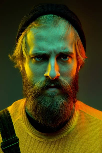 istock Caucasian man's portrait isolated on gradient studio background in neon light 1195025924