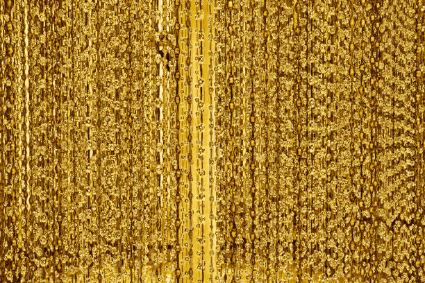 istock Abstract shiny golden lines and bubbles backdrop, blurred bokeh background, glowing gold colored decorative stripes pattern, yellow metallic glitter texture, holidays design, festive frame, copy space 1195027111
