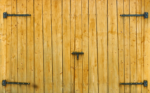 Yellow wooden gate on the ranch house for background or texture